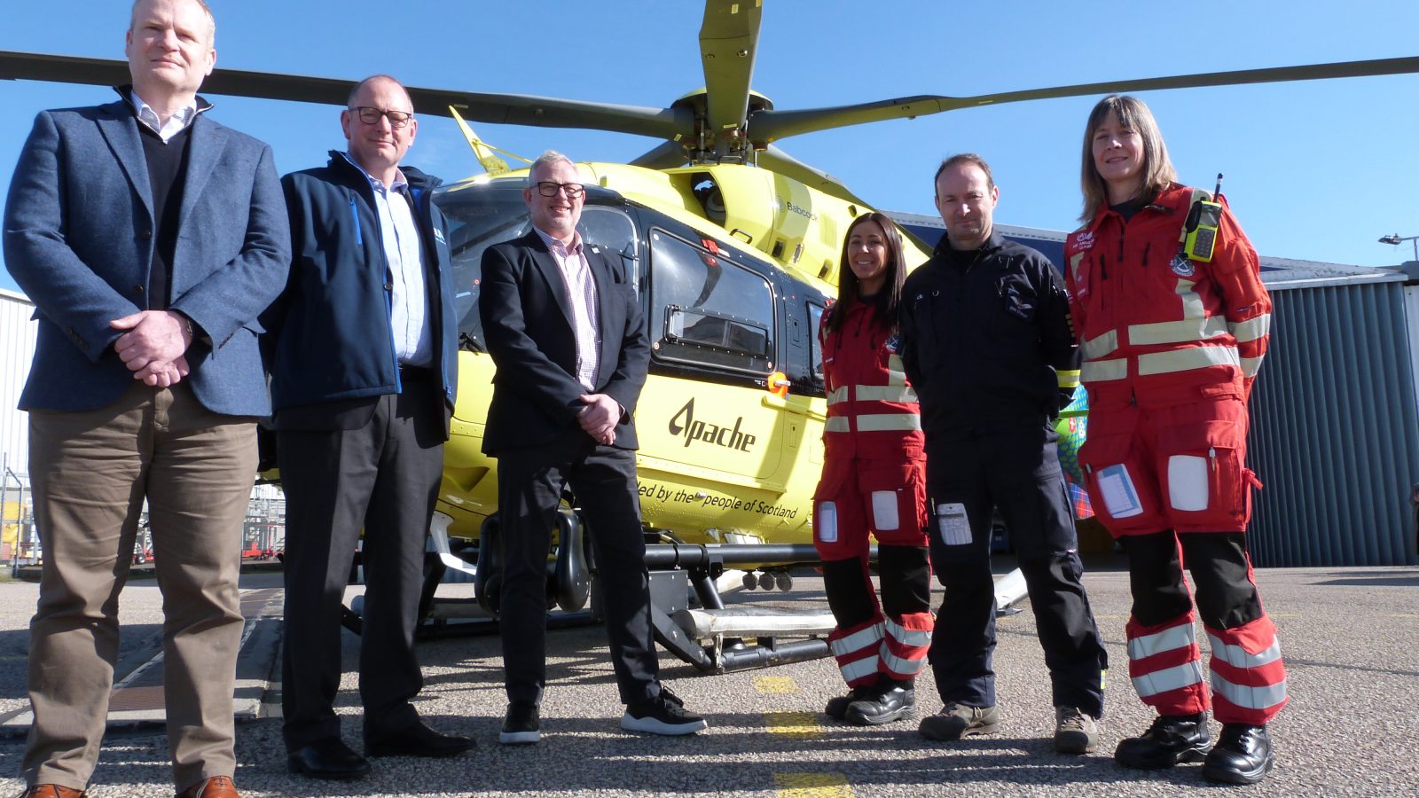 Stuart Taylor, Apache's operational performance director (far left), during a visit to SCAA's Aberdeen base and meets (from left) Chairman Robbie Brown, CEO David Craig, paramedic Laura Stephen, pilot Captain John Stupart and paramedic Claire Allan.