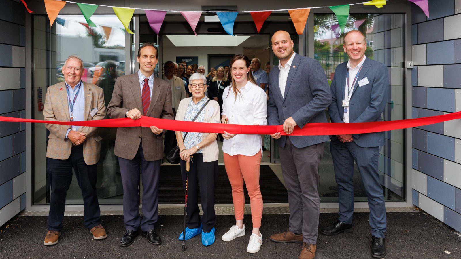 Attending the ribbon cutting ceremony to mark the official reopening of Bucksburn Swimming Pool are (l-r) Sport Aberdeen Chairman Tony Dawson, Cllr Martin Greig, Mrs Helga Shields, Hannah Miley, Cllr Alex McLellan and Sport Aberdeen Interim CEO Graeme Dale