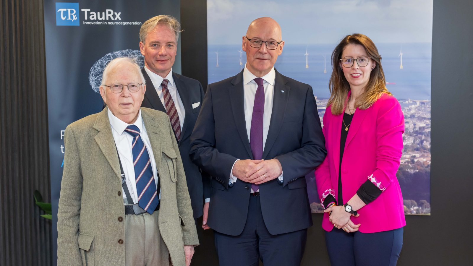 From left: Prof Claude Wishick (TauRx CEO), Dr Glenn Corr (TauRx Chief Operating Officer and Chief Business Officer), First Minister John Swinney and Áine Mishra (TauRx Head of Strategic Development).
