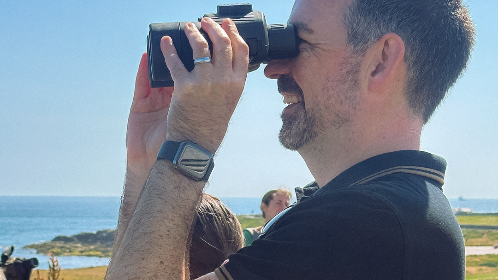 Bruce Watson at Greyhope Bay earlier this year after the organisation received funding for new binoculars from the fund for dolphin watching.