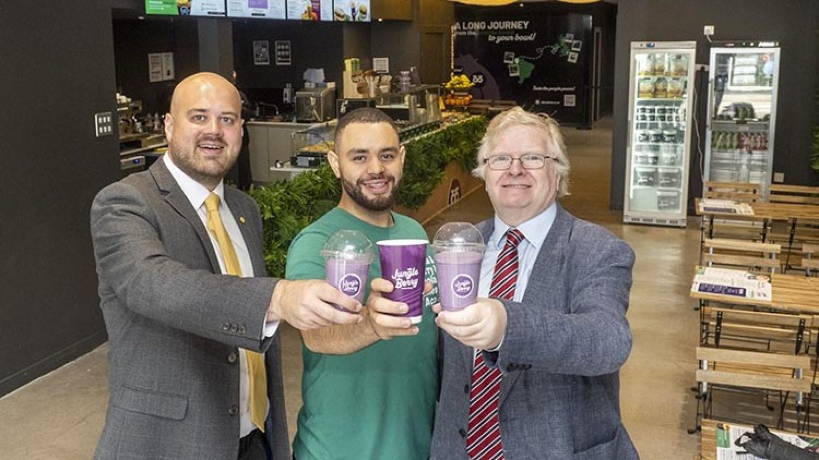 Councillors Alex McLellan and Iain Yuill with Jungle Berry owner Otavio Freitas.