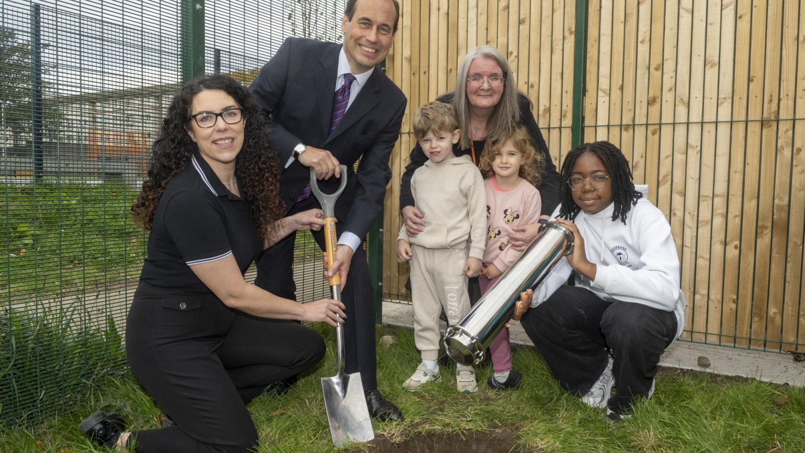 Councillors Greig and Mennie with Head Teacher Susan Ironside and pupils burying  a time capsule to mark the occasion