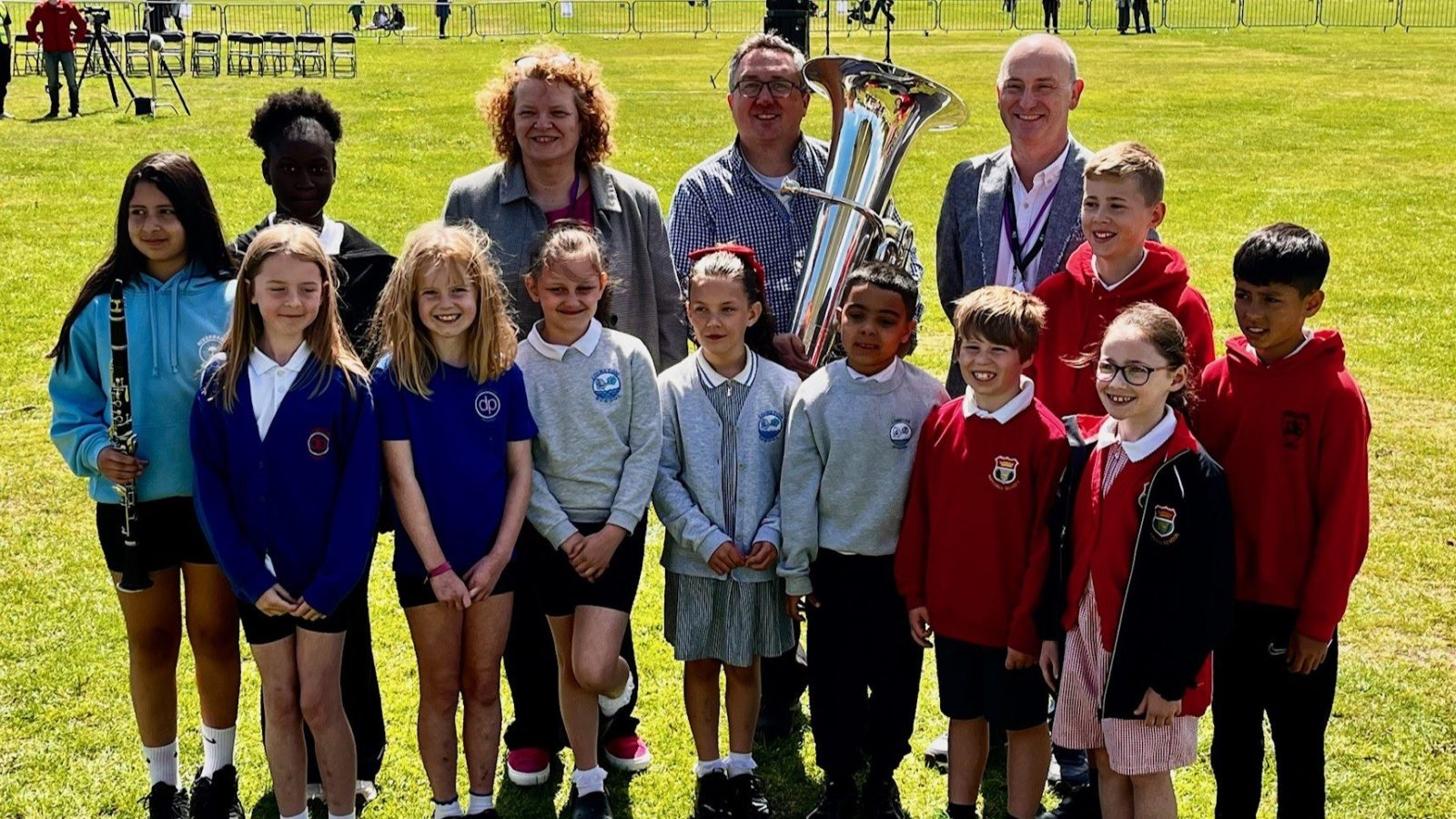 Image from left to right: Primary 4 pupils are pictured with Shona Milne, Chief Officer – Education and Lifelong Learning, Aberdeen City Council; John Whitener, Tuba player, RSNO; and Mark Cardy, Education Director, Charanga; at Aberdeen Big Sing and Play 2026, Duthie Park.