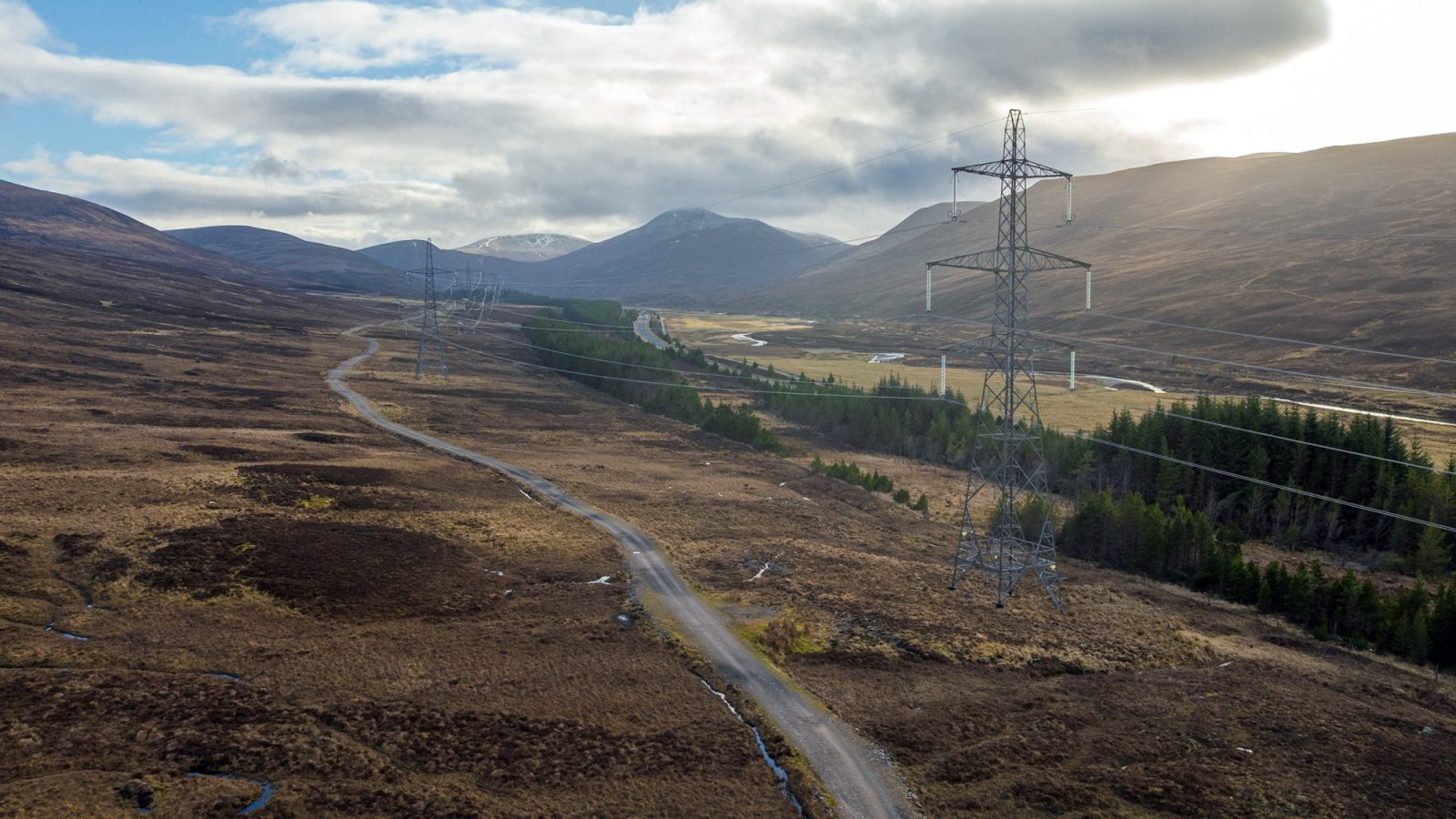 Transmission towers from the Beauly to Denny overhead line, comparable to the infrastructure proposed for the Beauly to Peterhead project.