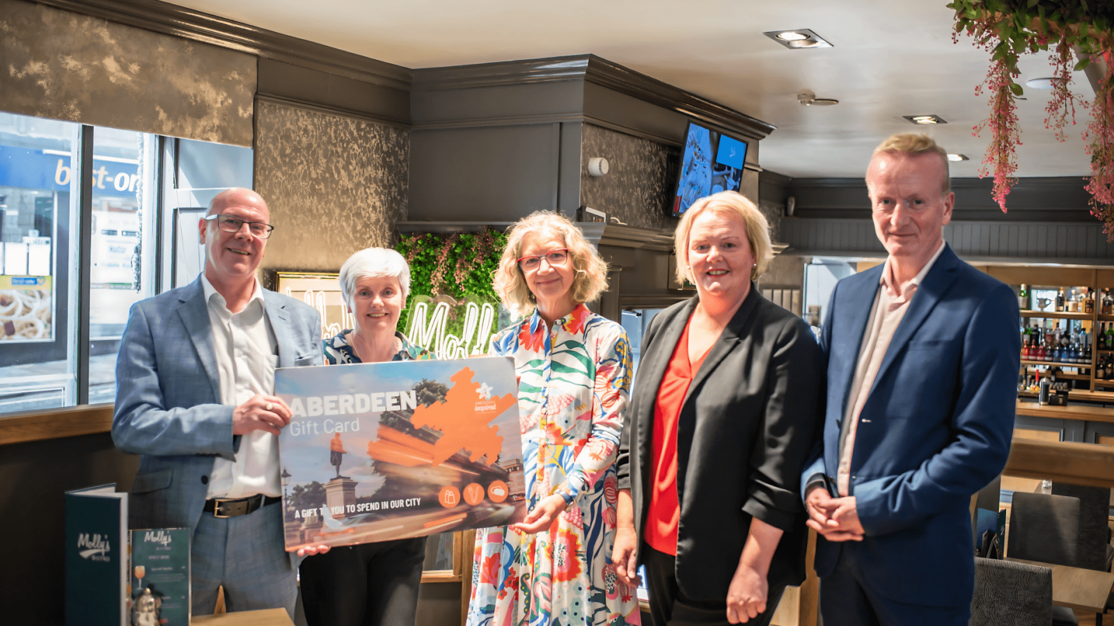 Supporting Scotland Loves Local Week in Aberdeen are, from left, Kevin Stewart MSP; Mary Martin, owner of Molly's Bistro; Audrey Nicoll MSP; Catherine Shaugnessy, manager of Molly's Bistro, and Adrian Watson, chief executive of Aberdeen Inspired. Image - Aberdeen Inspired