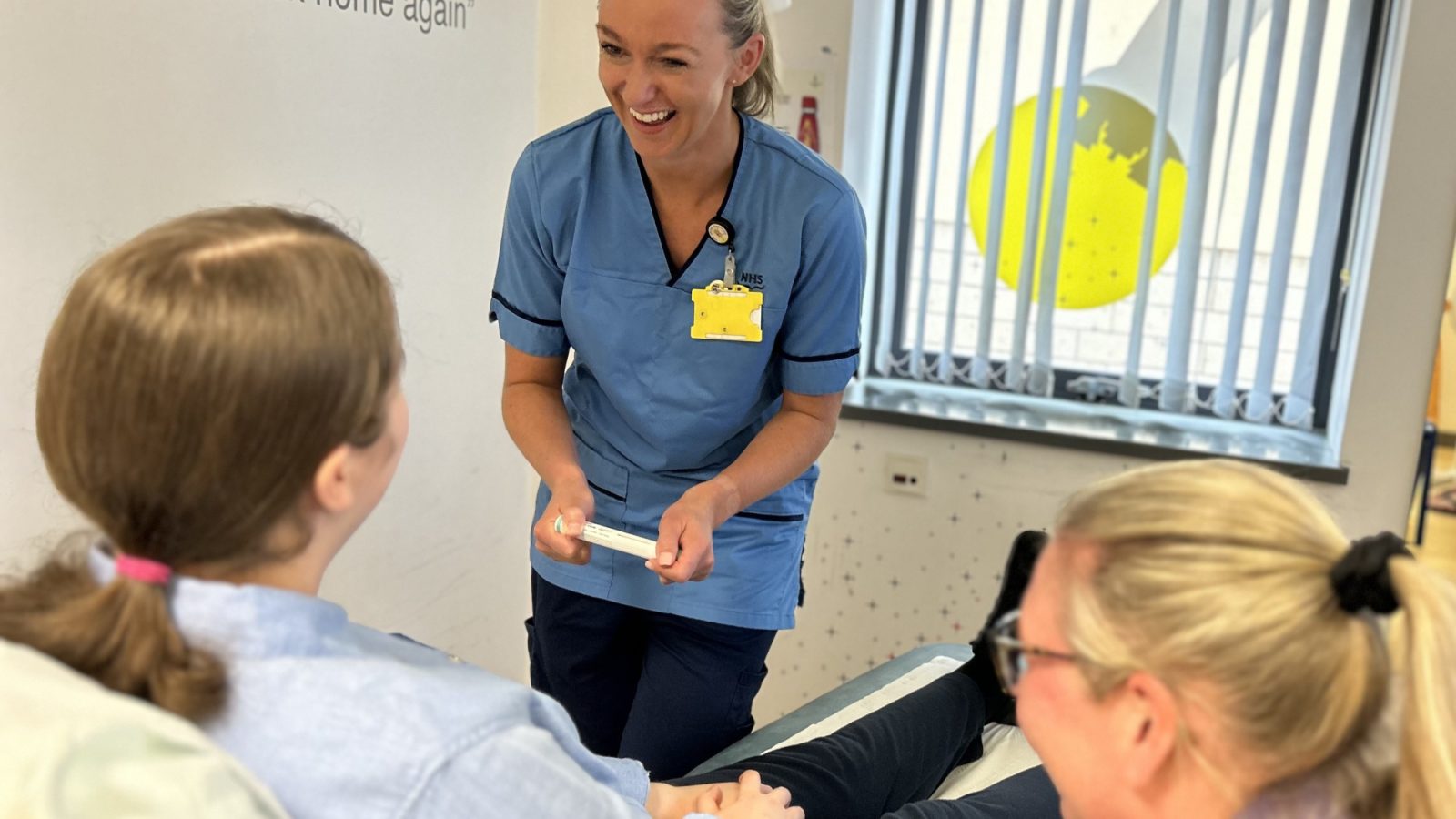 Rachel during an appointment with nurse specialist Chantelle, with support from play specialist Wendy