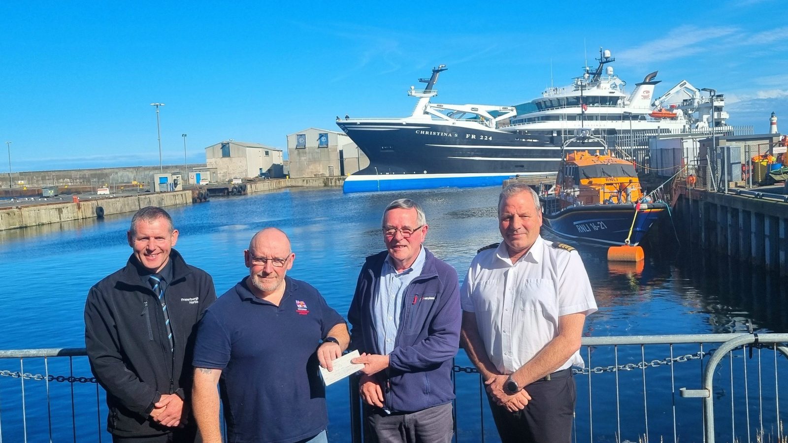 L-R: John Murison (Fraserburgh Harbour Superintendent), Vic Sutherland (RNLI Coxswain), John Fraser (Harbour Consultant), Shane Wood (Fraserburgh Harbour Master)
