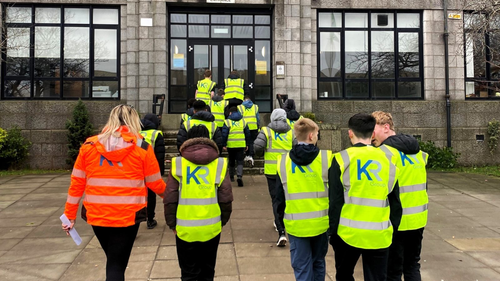 KR Group Scotland Operations Manager, Lyndsay Merson with pupils outside St. Machar Academy.