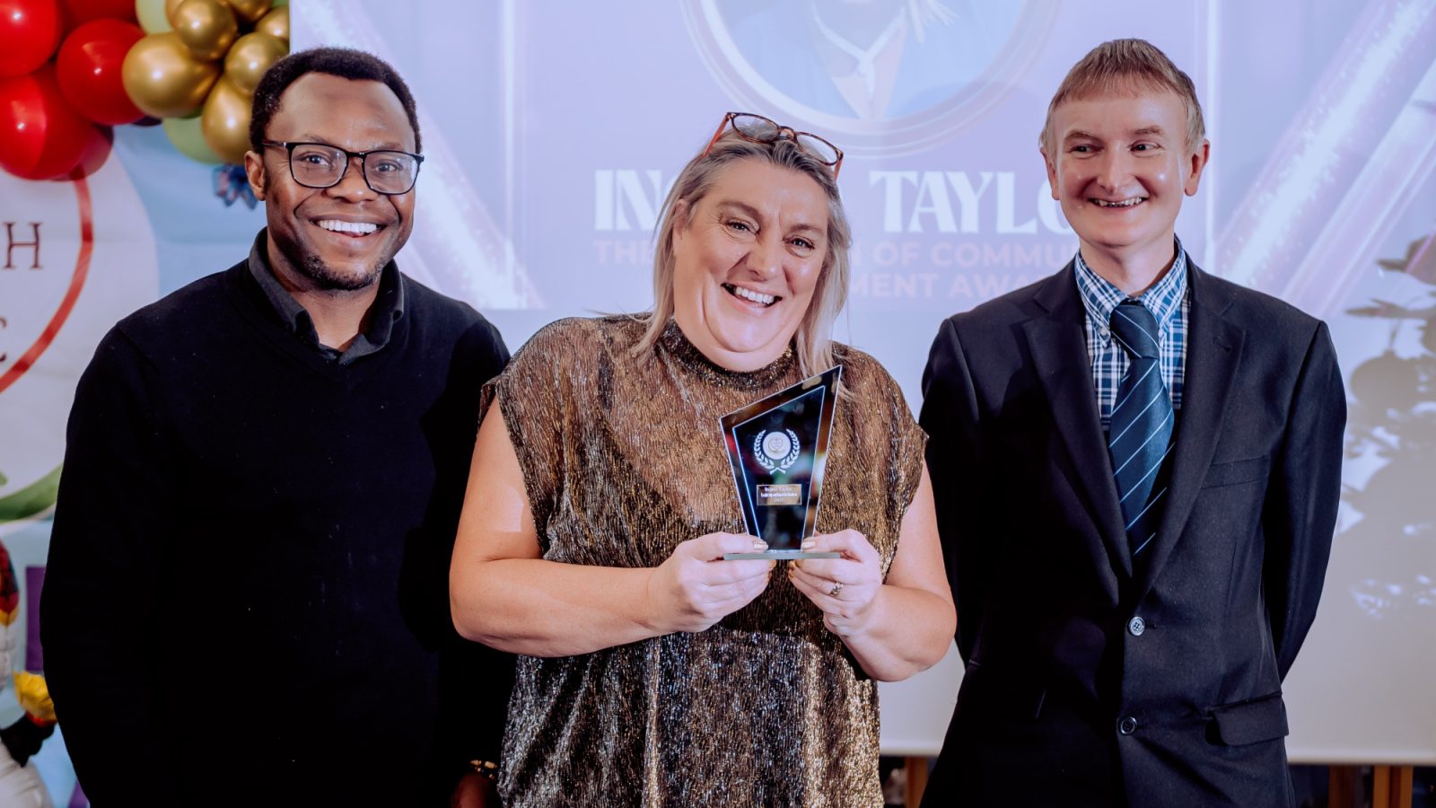 Ingrid Taylor receiving Champion of Community Empowerment Award