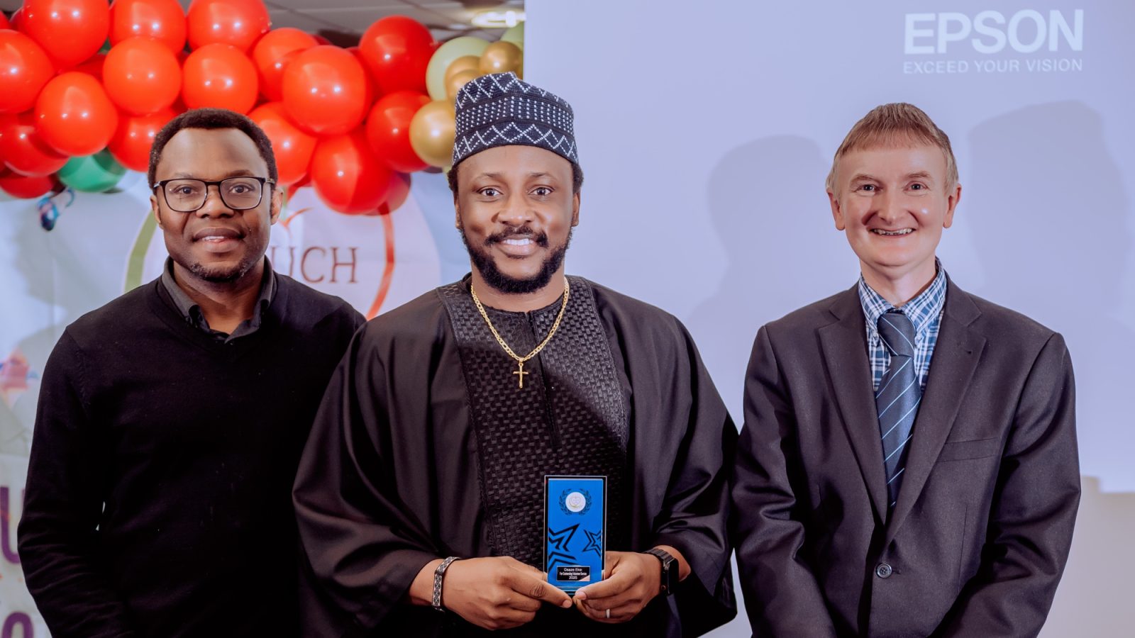 Osaze (Joseph) Eke receiving Volunteer of the Year Award