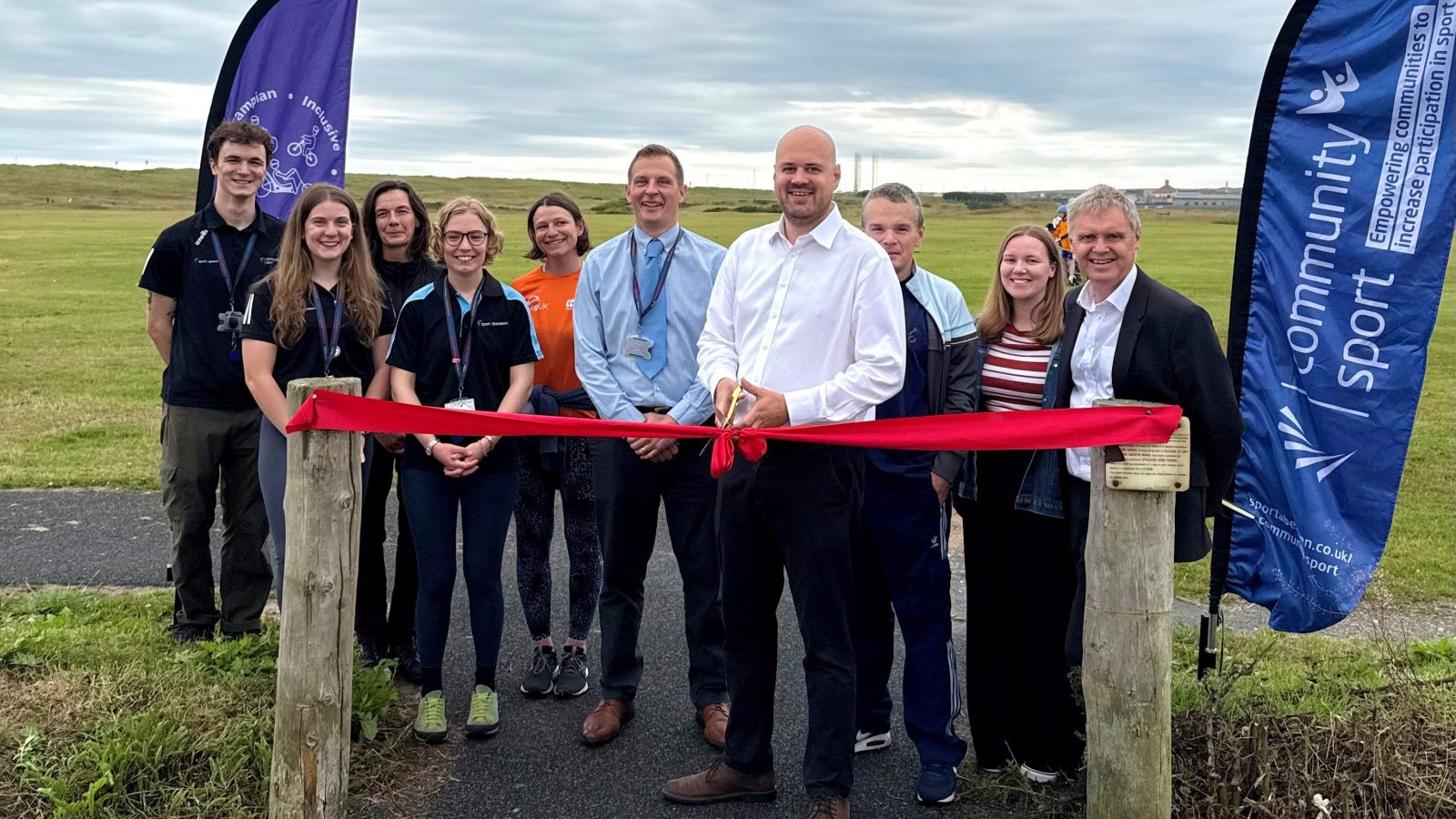 Cllr Alex McLennan, convener of Aberdeen City Council’s Finance and Resources Committee, cuts the ribbon to officially open the new path connecting Seaton to the beachfront