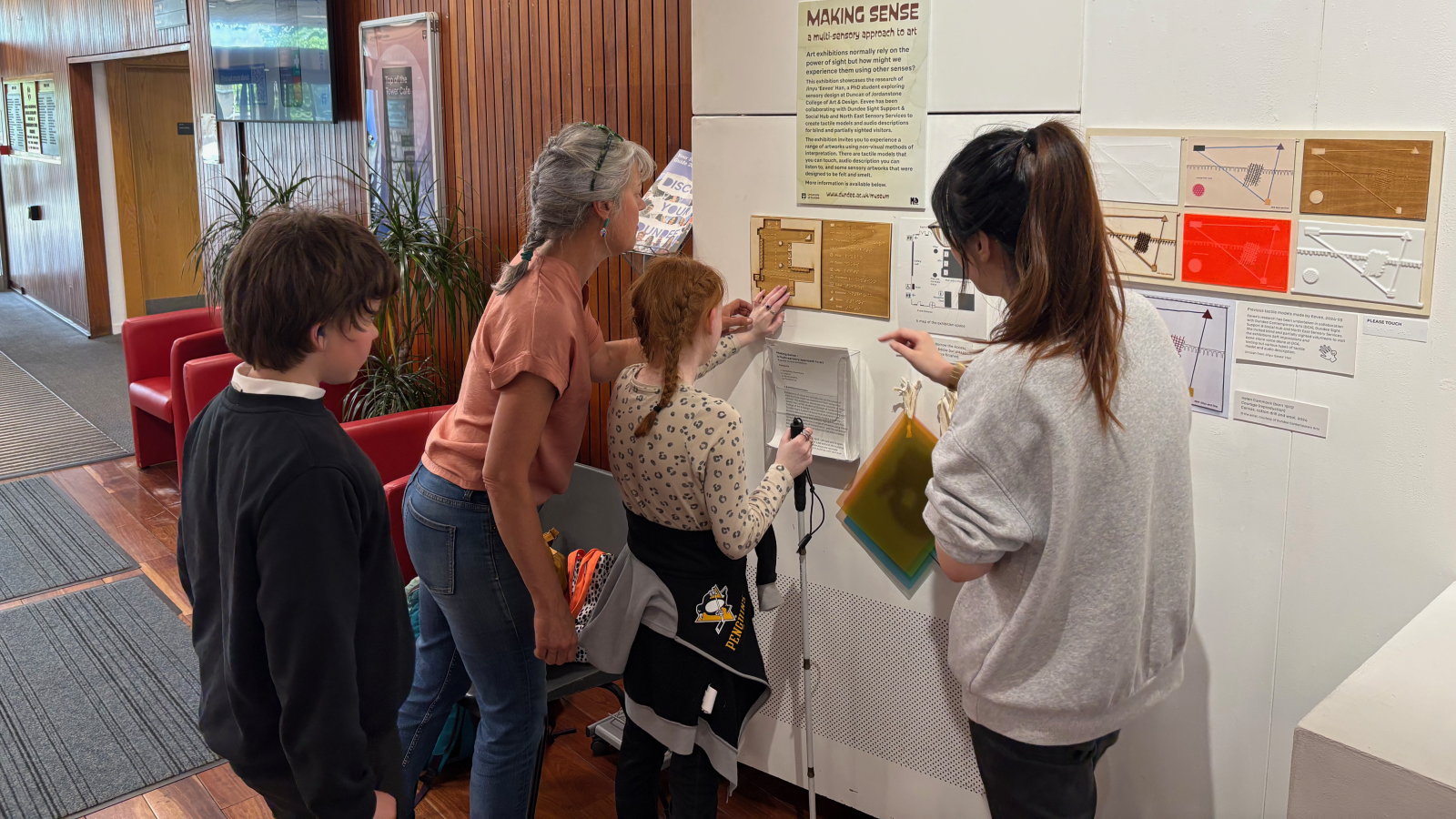 Eevee showing the artworks to YPSS members.