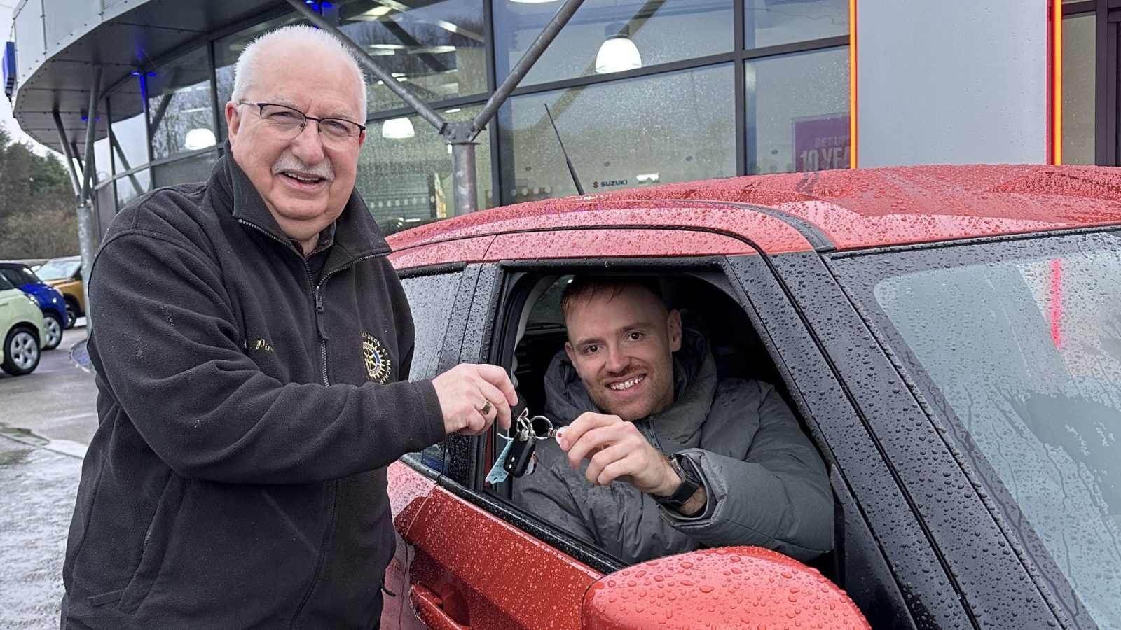 Rotary raffle organiser, Rotarian Alan Pirie, with winner Darral Murray