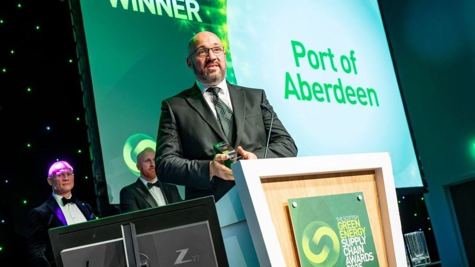 Neil McIntosh, Head of SHEQ, Port of Aberdeen collecting the Sustainable Supplier Award.
