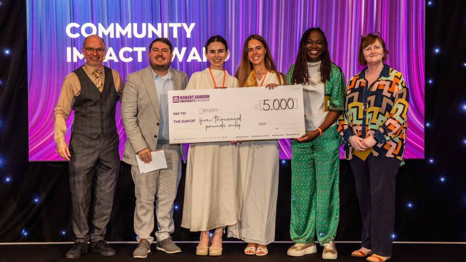 Carnie Bees winning alongside judges and Chris Moule