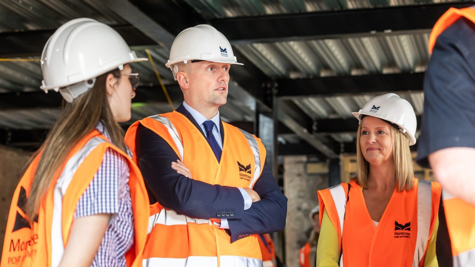 (L-R): Ashleigh Reid, a Vestas apprentice through Dundee & Angus College, Stephen Flynn MSP and Dundee & Angus College Vice Principal Julie Grace. 3 – Stephen Flyn MSP with offshore wind apprentices, staff and senior leadership from Dundee and Angus College.