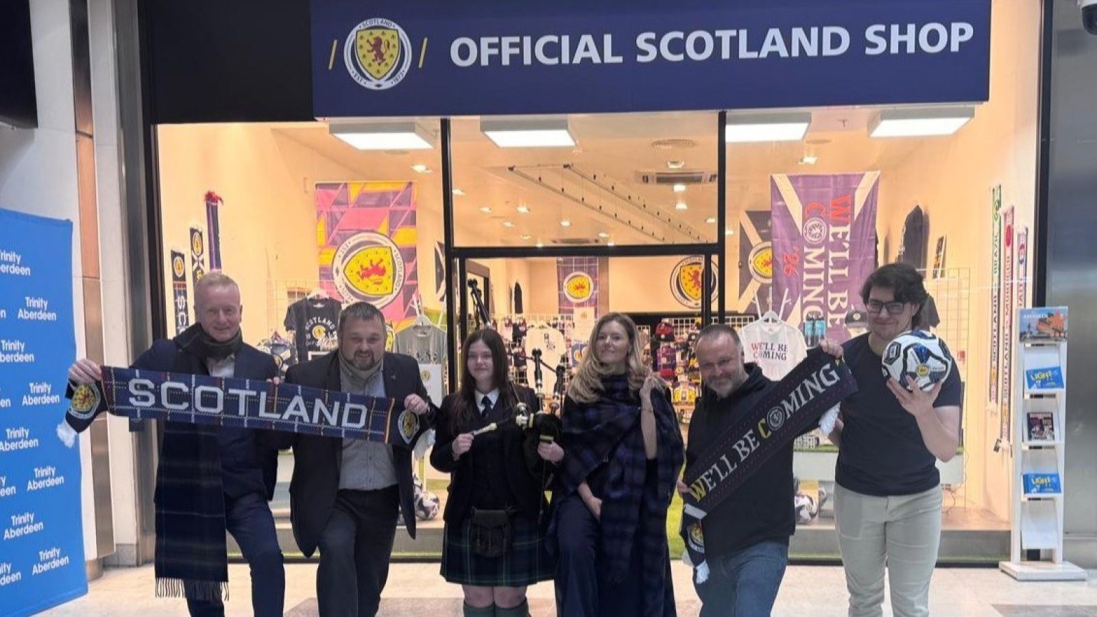 from left, Adrian Watson, chief executive of Aberdeen Inspired; Kenny Bruce, Centre Manager at Trinity Centre Aberdeen; piper Rebecca Knox, of Robert Gordon's College Pipe Band; Kate Kenyon, of Aberdeen Inspired, and Paul Thomas and Cameron McIntosh, both of the Official Scotland Shop. Image - Aberdeen Inspired
