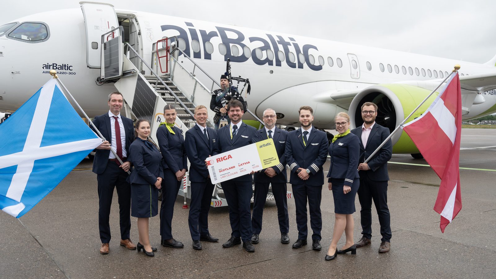 Robert Paterson, Operations Director Aberdeen International Airport and Jonathan Ford Portfolio Manager AGS Airports along with the airBaltic crew.