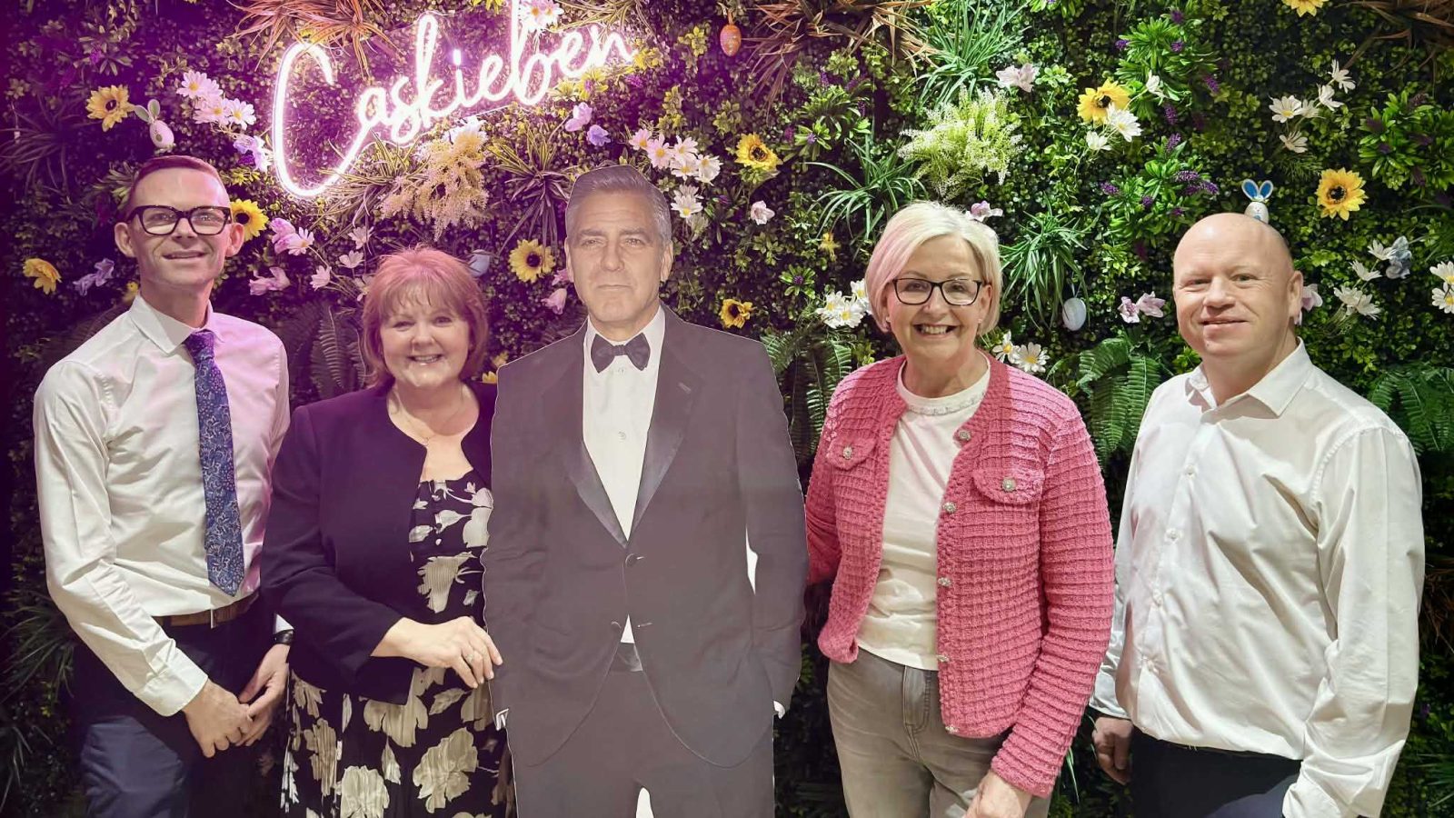 George Clooney pictured with Rona Grimmer (pink top), former Archie chair Carol Munro and Gavin Ord (with tie) and Kris Manship from the Aberdeen Dyce Hotel.