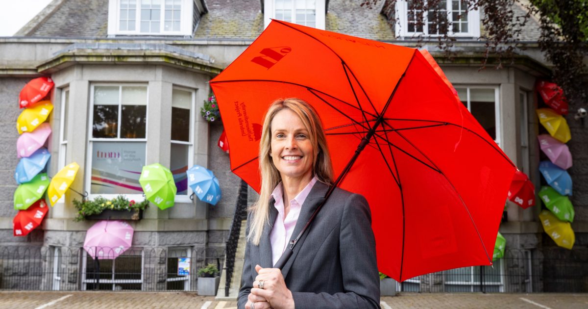 OpenGraph Image for TMM Recruitment stands under umbrella to raise awareness of neurodiversity and inclusion in retirement
